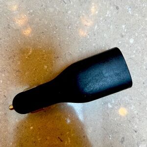 Charger w standard USB port. Plugs into wall or use in car cigarette lighter.